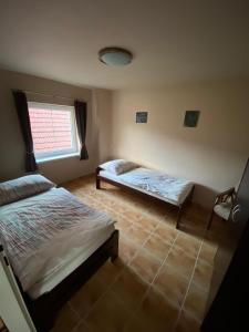 Postel nebo postele na pokoji v ubytování Domeček s výhledem