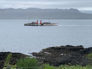 a large boat in the middle of a large body of water at Tighnamara-Skye in Saasaig