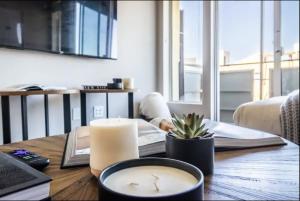 a candle on a table in a living room at Luxury 2bedroom 2bath Santa Monica in Los Angeles