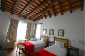 เตียงในห้องที่ Hotel Hostal del Espinillo