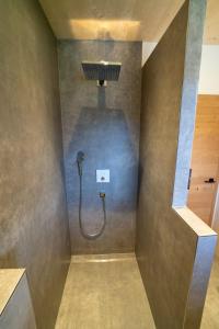 a shower in a bathroom with a shower head at Einfach Leben - Urlaub in den Bergen in Tauplitz