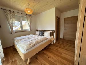 Rúm í herbergi á Einfach Leben - Urlaub in den Bergen