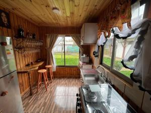 an interior view of a kitchen in a rv at Alojamiento Machicura in Linares