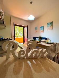 A seating area at NaturAmare Apartments Palinuro