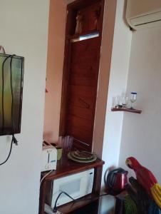 TV a/nebo společenská místnost v ubytování AH KIN Cancun Centro