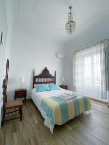 Säng eller sängar i ett rum på Pias Guesthouse