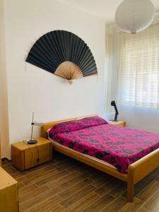 En eller flere senge i et værelse på Viva la Nonna