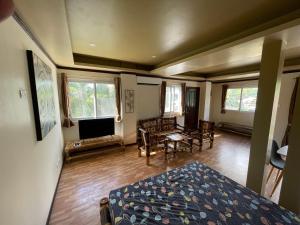 a bedroom with a bed and a living room at Rose Apartment 