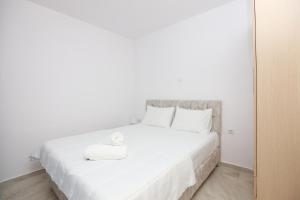 Postel nebo postele na pokoji v ubytování Vergia Apartment 1
