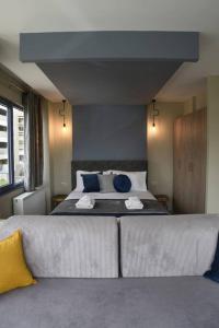 Ένα ή περισσότερα κρεβάτια σε δωμάτιο στο Porto Boutique #A