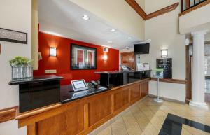 a bar in a restaurant with orange walls at Extended Stay America Suites - Las Vegas - East Flamingo in Las Vegas