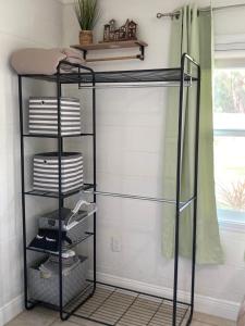 a black iron bunk bed in a bathroom at Seashell Studio near FIT/beach in Melbourne