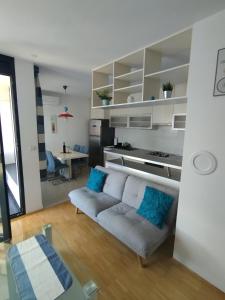 a living room with a couch and a table at Apartment Bencic in Umag