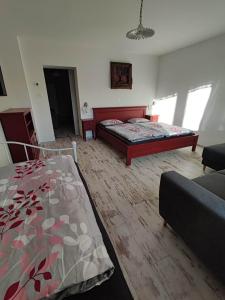 a living room with two beds and a couch at Apartmán Šumiac 6 in Šumiac