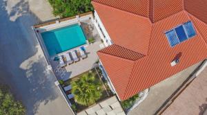 an overhead view of a house with an orange roof at Estella Luxury Villa in Amoudi -200m from the beach in Amoudi