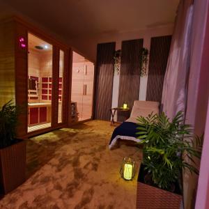 a room with a bed and some plants in it at Villa Conte in Podstrana +32 photos