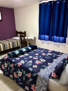 Un pat sau paturi într-o cameră la Pousada do Gil