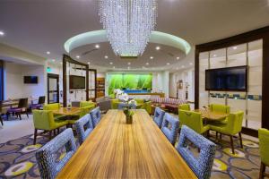 a conference room with a long table and chairs at SpringHill Suites by Marriott Wilmington Mayfaire in Wilmington