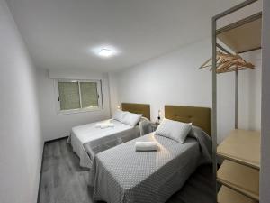 Tempat tidur dalam kamar di O Fogar de Elisa