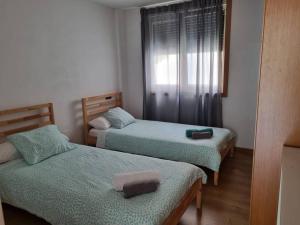 Postel nebo postele na pokoji v ubytování Morada as Neves -2A. Buena Vista