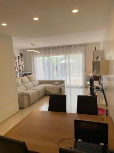 a living room with a table and a couch at Empordà Country House in Borrassá
