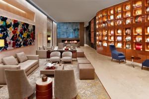 a lobby of a hotel with couches and chairs at The St. Regis Istanbul in Istanbul