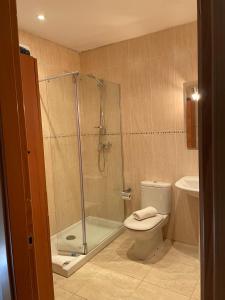 a bathroom with a shower and a toilet and a sink at Empordà Country House in Borrassá