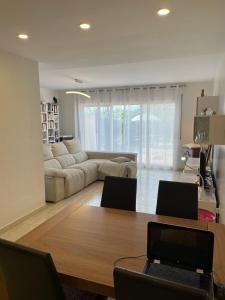 a living room with a table and a couch at Empordà Country House in Borrassá