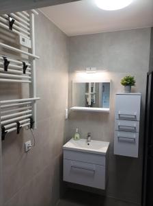 Phòng tắm tại Domki Apartamentowe AURA +21 ảnh