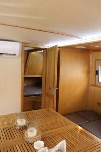 a table in a room with a cupboard at Free Room Boat Apartment in Belgrade