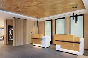 a lobby with wood paneling and glass windows at Fairfield by Marriott Gifu Gujo in Gujo