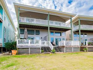a large house with a lawn in front of it at Turtle Creek #A in Orange Beach