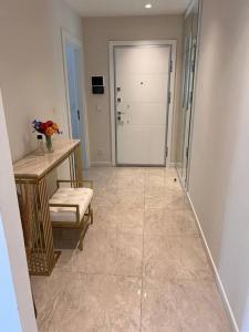 a bathroom with a shower and a bench and a table at Kordon İstanbul Luxury House 3+1 in Istanbul