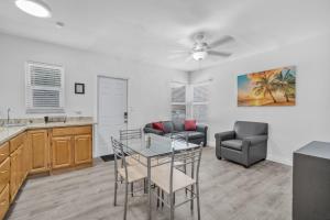 a kitchen and dining room with a table and chairs at Laguna Blu Beach in Hollywood