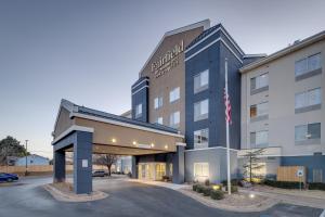 a hotel building with a parking lot in front of it at Fairfield Inn & Suites by Marriott Lawton in Lawton