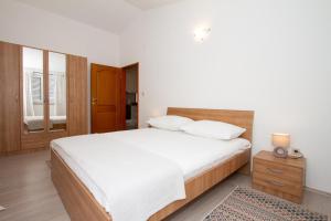 Postel nebo postele na pokoji v ubytování Apartman Francesca