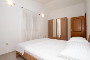 Postel nebo postele na pokoji v ubytování Apartman Francesca