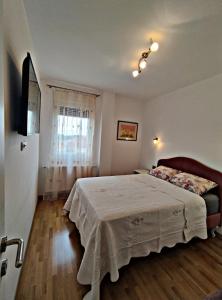 Postel nebo postele na pokoji v ubytování Glušac Lux