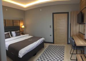 Ein Bett oder Betten in einem Zimmer der Unterkunft Kaya Life Resort