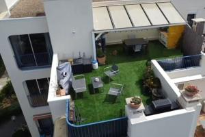 an aerial view of a backyard of a building at Appartement avec grande terrasse à la Grande Motte in La Grande-Motte