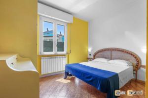 Ένα ή περισσότερα κρεβάτια σε δωμάτιο στο Essenza di Mare - Casa Vacanze