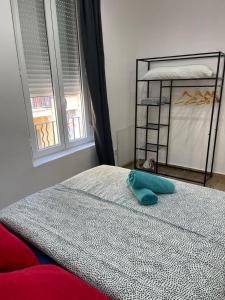 Posteľ alebo postele v izbe v ubytovaní Downtown Apartments