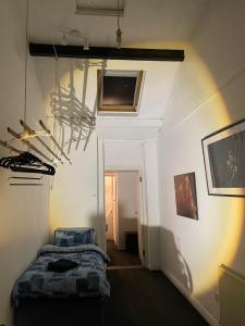 a bedroom with a bed and a hallway at Charming Central House in Dublin