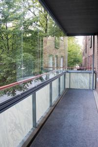 an empty balcony with a view of a building at Lahti Center House in Lahti