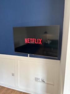 a flat screen tv sitting on top of a cabinet at Arlos in Blackpool