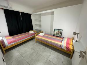 Un pat sau paturi într-o cameră la CASA TEOS