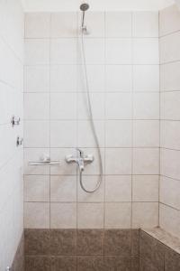 a shower with a hose in a bathroom at Mimis Villa in Igoumenitsa +30 photos