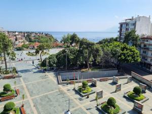 a park with benches and trees in a city at Royal Homes 403 in Antalya