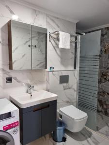 a bathroom with a sink and a toilet at Royal Homes 403 in Antalya