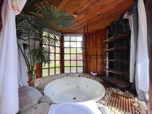 a large bath room with a large bath tub at The 'Nook' - Cabin in the Tassie Wilderness! in Ridgeway